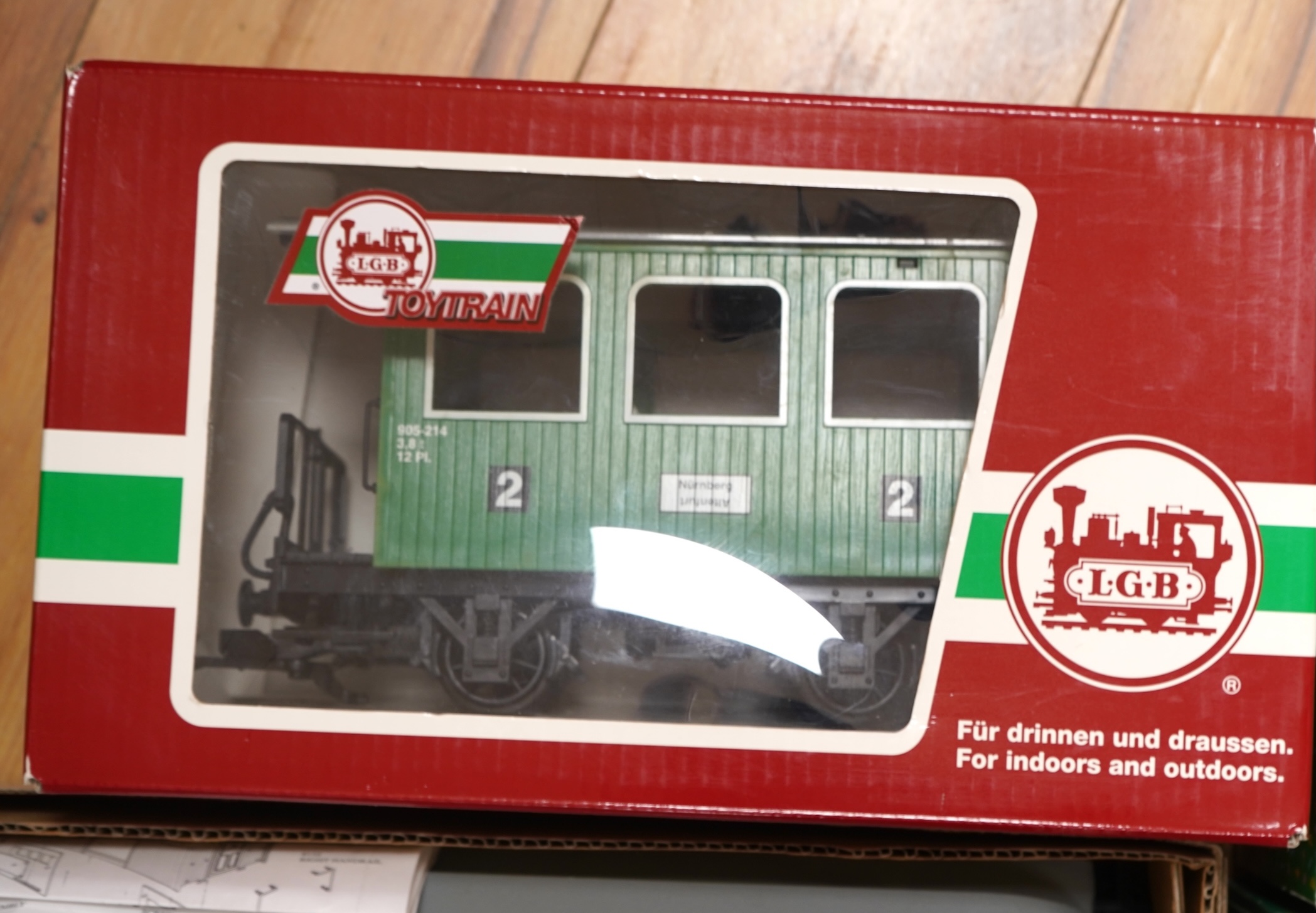 Four Lehmann and Bachmann G scale (45mm gauge) freight wagons; an unconstructed Bachmann Big Haulers G Kits 4-door Baggage Car (98910), an LGB 4-wheel coach in associated box, plus two others by Lehmann Toytrain in assoc